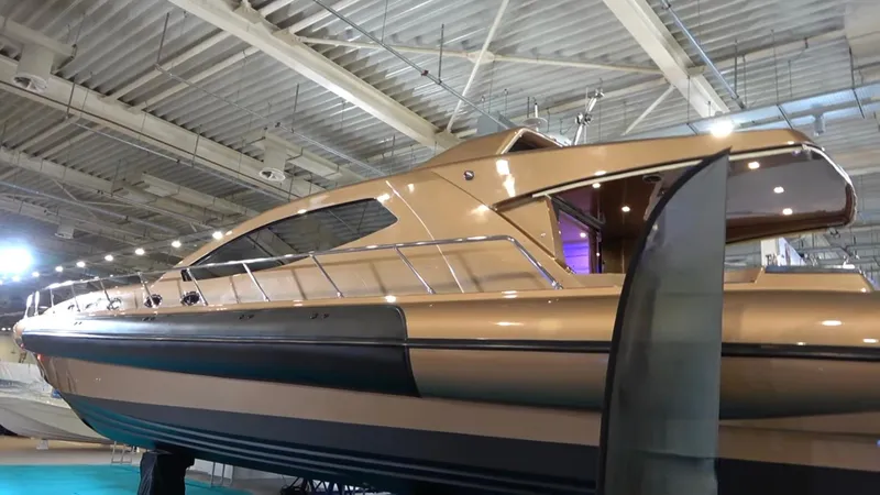 1676 Yacht Photos Pics Luxurious Custom RIB 60 boat from 2023 in an exhibition hall.