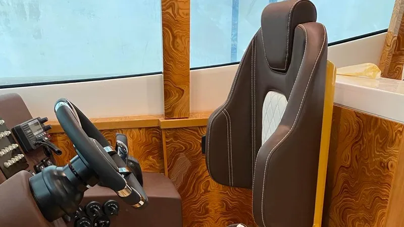 1676 Yacht Photos Pics Interior of Custom RIB 60 boat, 2023, featuring steering wheel and seat.
