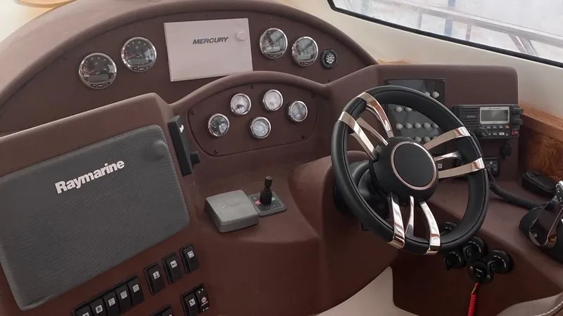 1676 Yacht Photos Pics Custom RIB 60 boat helm, 2023 model, featuring advanced controls.