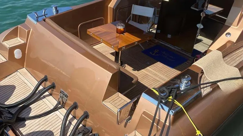 1676 Yacht Photos Pics Luxurious Custom RIB 60 boat, 2023, featuring elegant interior and wooden table.