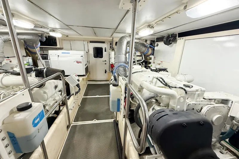 Ring Leader Yacht Photos Pics Engine room of 2007 Nordic Tug 54, featuring dual engines and equipment.