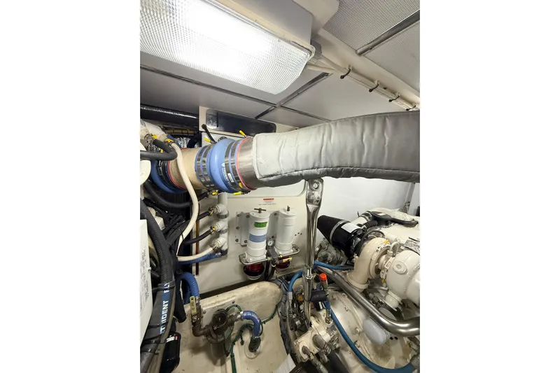 Ring Leader Yacht Photos Pics Engine room of a 2007 Nordic Tug 54, showcasing mechanical components and piping.