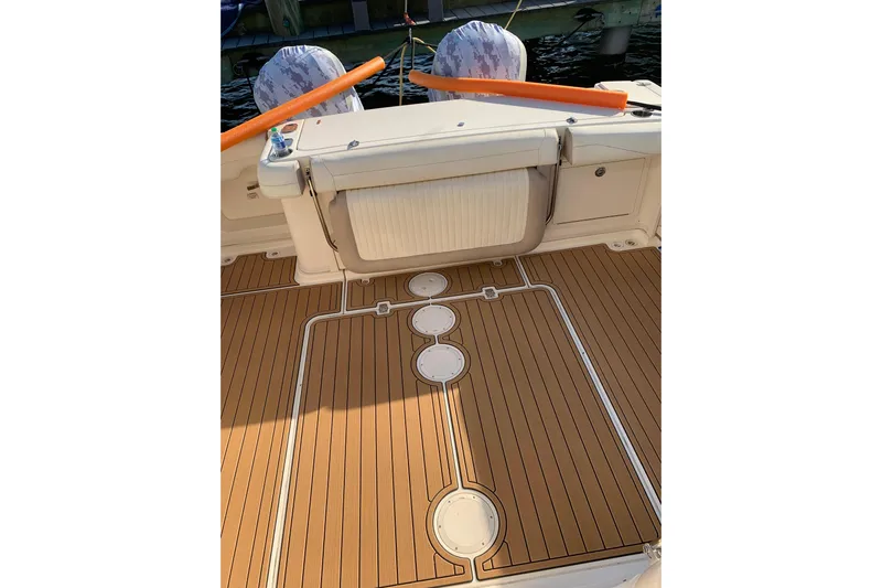  Yacht Photos Pics 2014 Grady-White Express 330 boat deck with wood finish and seating area.