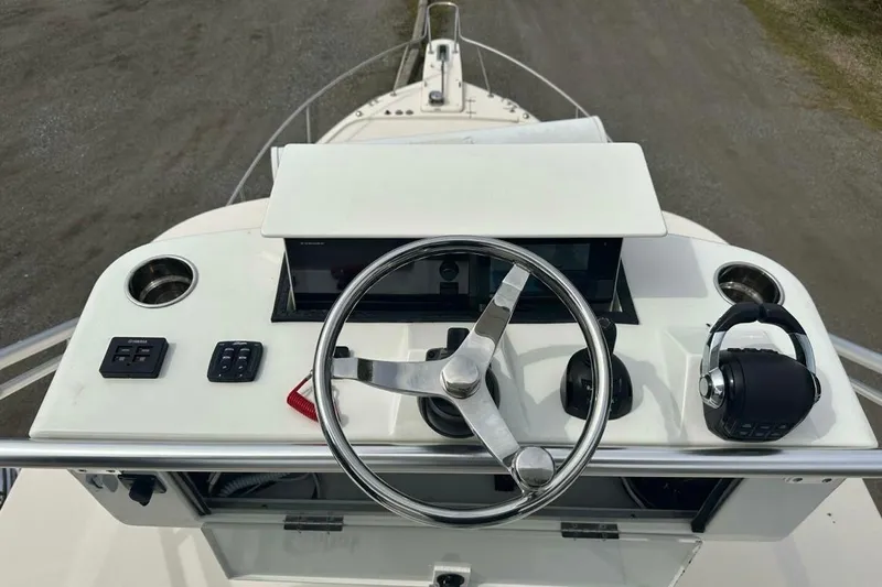  Yacht Photos Pics 2014 Grady-White Express 330 helm with steering wheel and controls.
