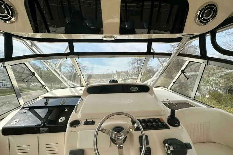  Yacht Photos Pics 2014 Grady-White Express 330 boat helm with steering wheel and control panel.