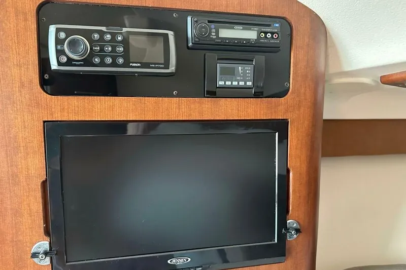  Yacht Photos Pics 2014 Grady-White Express 330 cabin electronics panel with audio system and screen.