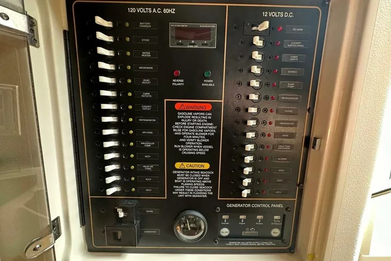  Yacht Photos Pics 2014 Grady-White Express 330 electrical control panel with switches and warnings.