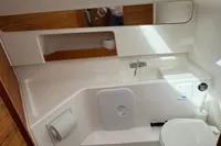 Modern bathroom in 2022 Nimbus W9 boat with sleek design and compact amenities.