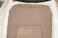 2022 Nimbus W9 boat with beige sunpad and sleek windshield design.