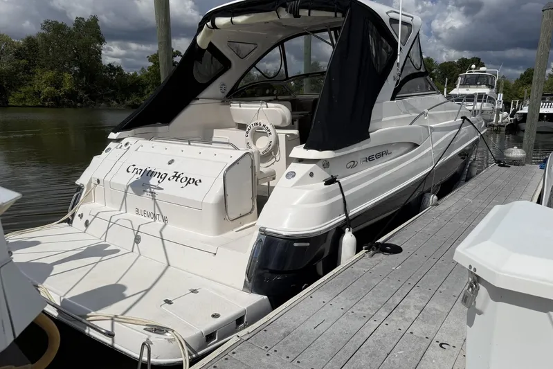  Yacht Photos Pics 2006 Regal Commodore 3560 yacht docked, featuring sleek design and "Crafting Hope" name.