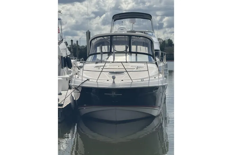  Yacht Photos Pics 2006 Regal Commodore 3560 yacht docked on a calm, cloudy day.