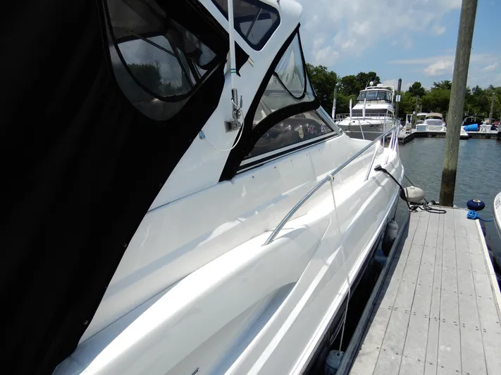  Yacht Photos Pics 2006 Regal Commodore 3760 IO yacht docked at marina under clear sky.