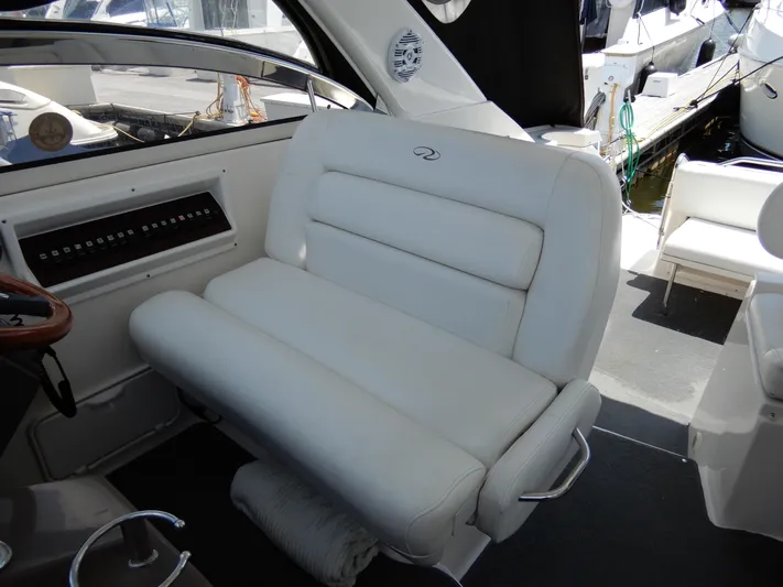  Yacht Photos Pics 2006 Regal Commodore 3760 IO boat interior with white leather seating and control panel.