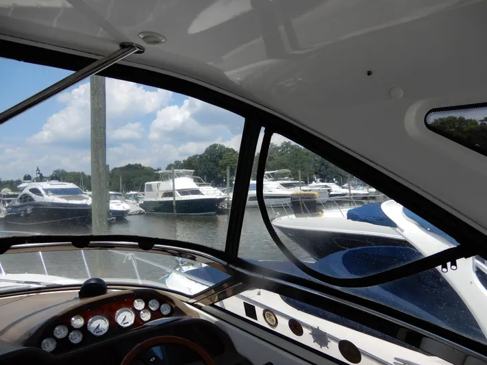  Yacht Photos Pics View from 2006 Regal Commodore 3760 IO boat cockpit, overlooking marina with multiple yachts.