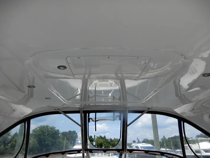  Yacht Photos Pics 2006 Regal Commodore 3760 IO boat interior ceiling with windows and outdoor view.