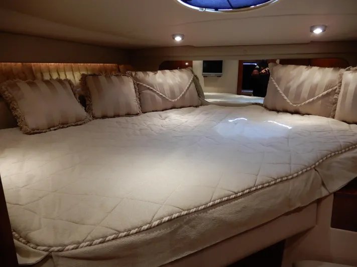  Yacht Photos Pics Luxurious cabin interior of 2006 Regal Commodore 3760 IO with plush bedding and ambient lighting.