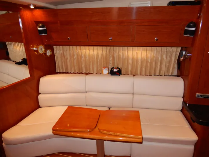  Yacht Photos Pics Luxurious interior of 2006 Regal Commodore 3760 IO yacht with plush seating and wooden accents.