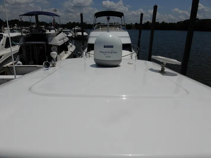  Yacht Photos Pics 2006 Regal Commodore 3760 IO yacht docked at marina with satellite equipment.