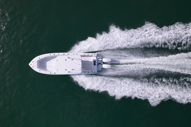  Yacht Photos Pics Aerial view of 2024 Bluewater 2550 boat speeding on water.