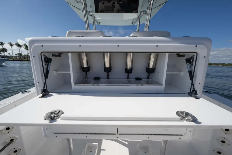  Yacht Photos Pics 2024 Bluewater 2550 boat with open storage compartment, showcasing sleek design and functionality.