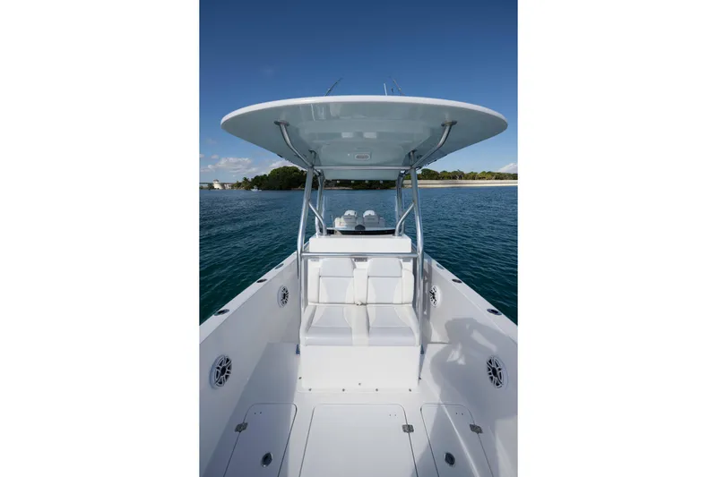  Yacht Photos Pics 2024 Bluewater 2550 boat on calm water, featuring sleek design and spacious deck.