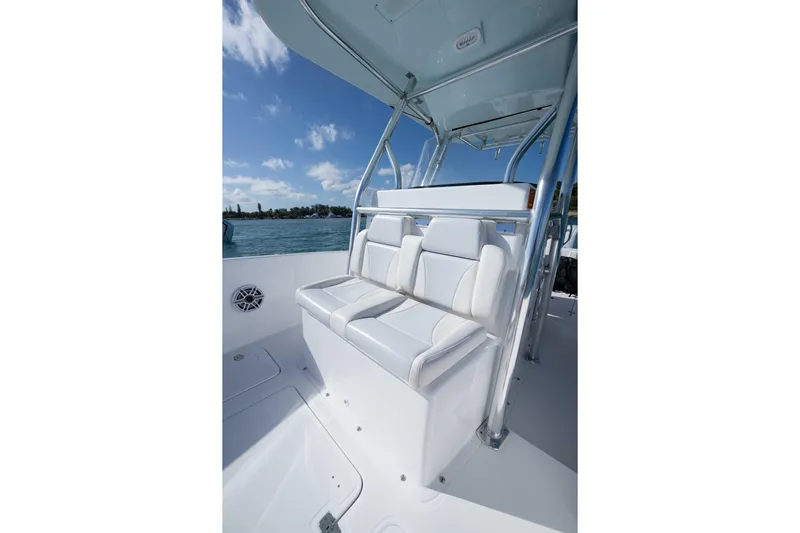  Yacht Photos Pics 2024 Bluewater 2550 boat interior with white seating and stainless steel frame.