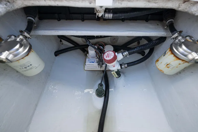 Yacht Photos Pics 2024 Bluewater 2550 boat engine compartment with fuel filters and hoses.