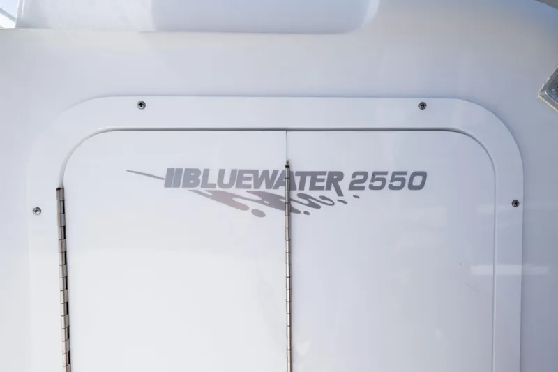  Yacht Photos Pics 2024 Bluewater 2550 boat logo on white surface.
