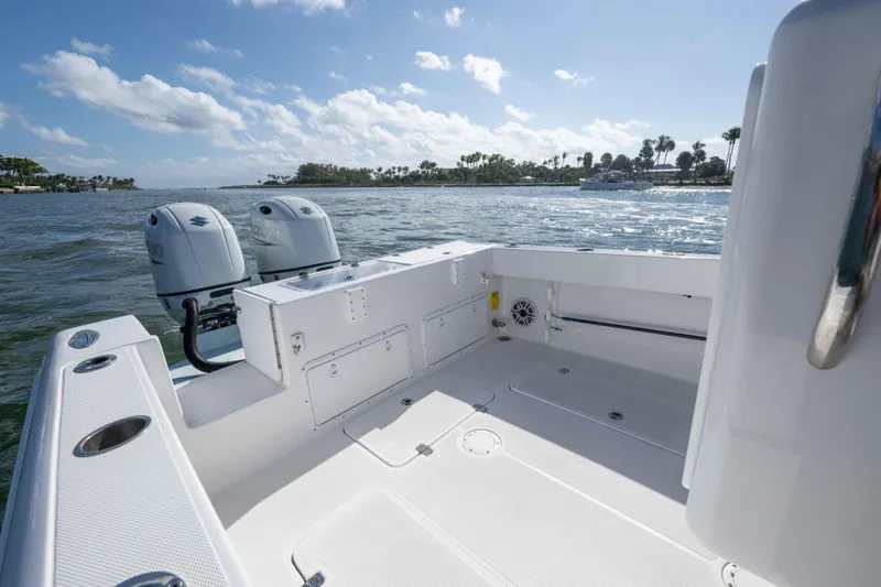  Yacht Photos Pics 2024 Bluewater 2550 boat with dual engines on a sunny day.