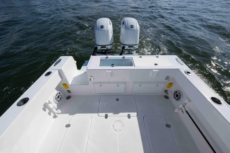  Yacht Photos Pics 2024 Bluewater 2550 boat deck with dual engines on open water.