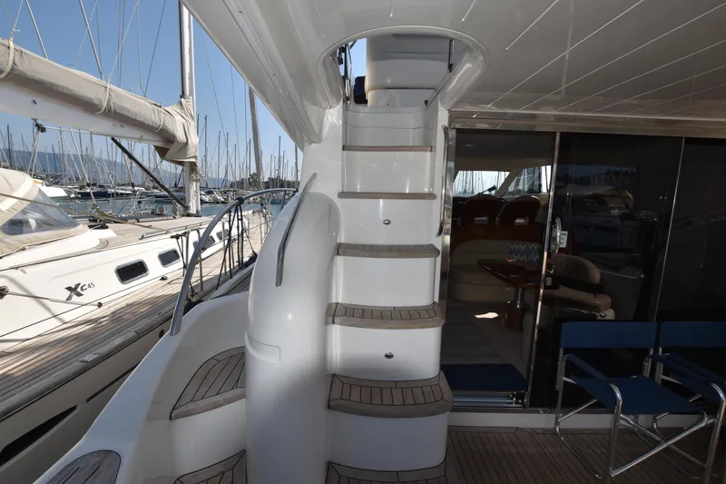 Spirit Bear Yacht Photos Pics Interior view of 2006 Princess 50 yacht with stairs and seating area.