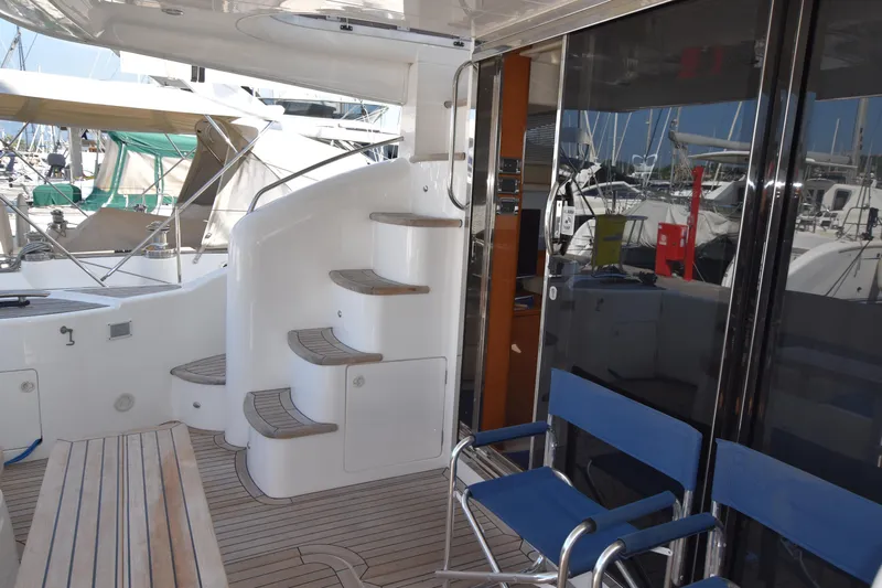 Spirit Bear Yacht Photos Pics Luxurious 2006 Princess 50 yacht interior with wooden steps and seating area.