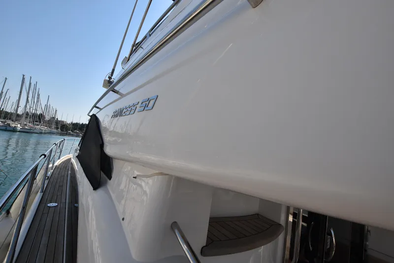 Spirit Bear Yacht Photos Pics Side view of a 2006 Princess 50 yacht docked at a marina.