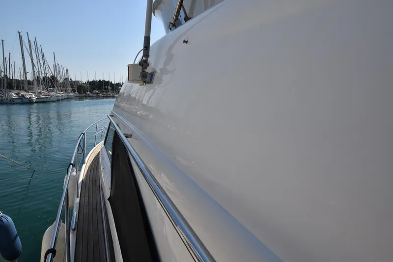 Spirit Bear Yacht Photos Pics Side view of a 2006 Princess 50 yacht docked in a marina.