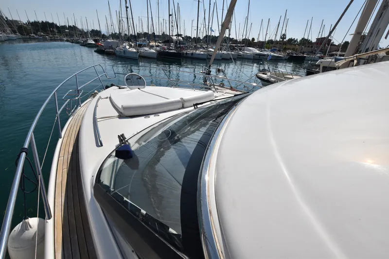 Spirit Bear Yacht Photos Pics Luxury Princess 50 yacht from 2006 docked in a marina with sailboats.