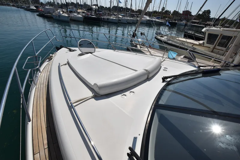 Spirit Bear Yacht Photos Pics 2006 Princess 50 yacht docked in marina, showcasing sleek deck design.