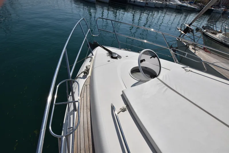 Spirit Bear Yacht Photos Pics 2006 Princess 50 yacht deck with railing and hatch, docked in marina.