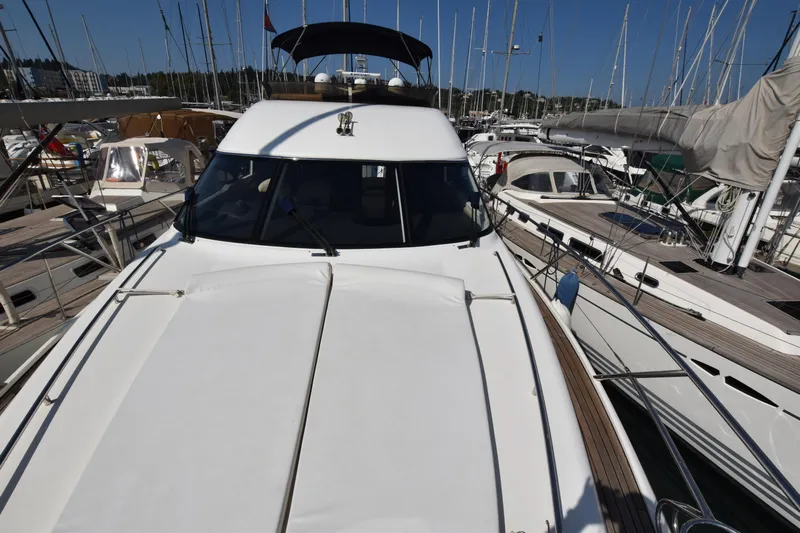 Spirit Bear Yacht Photos Pics 2006 Princess 50 yacht docked among other boats in a marina.