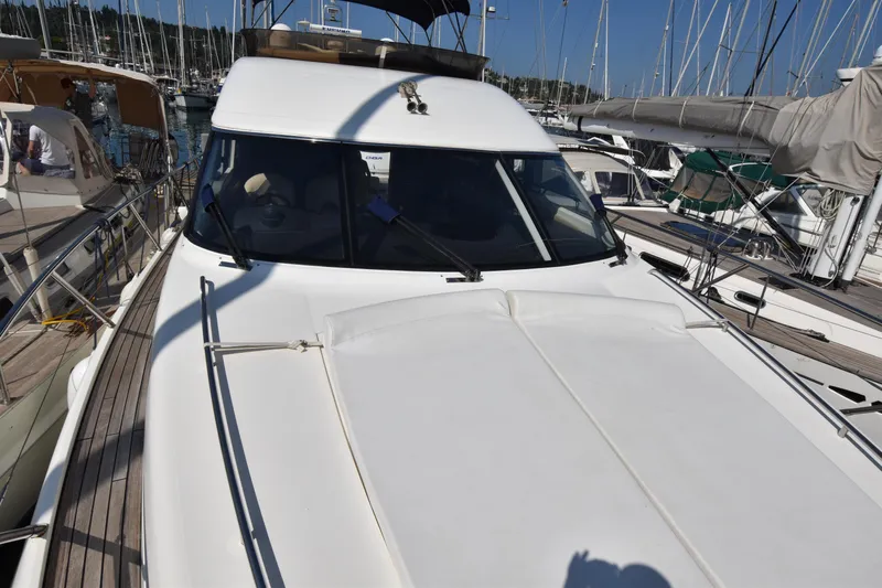 Spirit Bear Yacht Photos Pics 2006 Princess 50 yacht docked in marina, surrounded by sailboats.