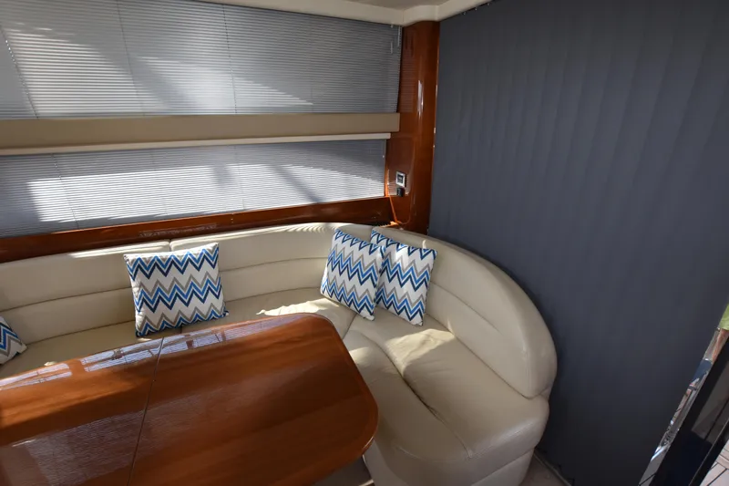 Spirit Bear Yacht Photos Pics Luxurious 2006 Princess 50 yacht interior with plush seating and chevron-patterned cushions.