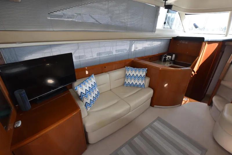 Spirit Bear Yacht Photos Pics Luxurious interior of 2006 Princess 50 yacht with leather sofa and modern amenities.