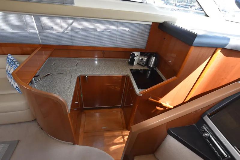 Spirit Bear Yacht Photos Pics Luxurious 2006 Princess 50 yacht kitchen with granite countertops and modern appliances.