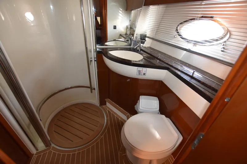 Spirit Bear Yacht Photos Pics Luxurious bathroom in 2006 Princess 50 yacht with modern fixtures and wooden accents.