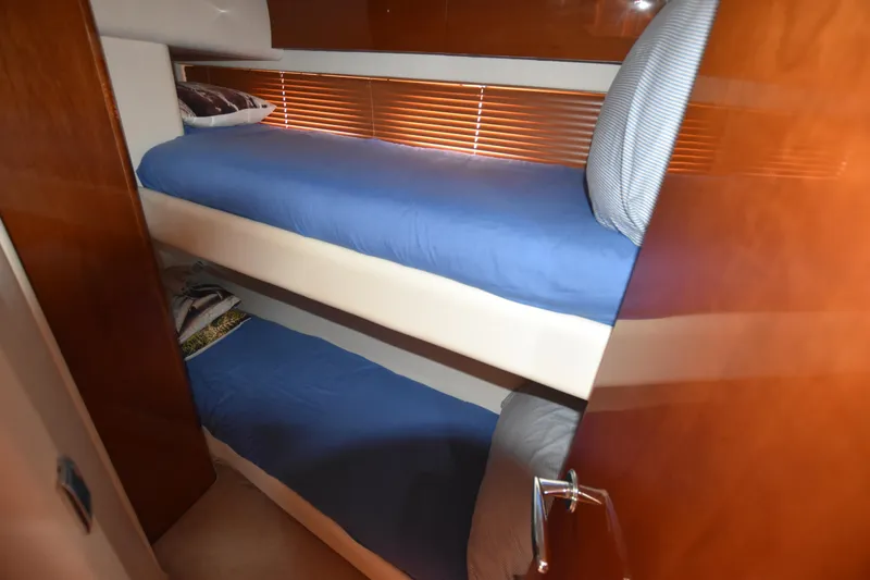 Spirit Bear Yacht Photos Pics Bunk beds in a 2006 Princess 50 yacht cabin with blue bedding.