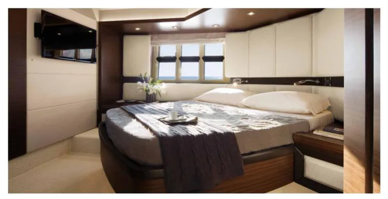  Yacht Photos Pics Luxurious bedroom interior of 2012 Azimut 55S yacht with modern design and cozy ambiance.