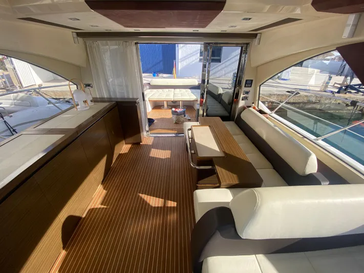  Yacht Photos Pics Luxurious interior of a 2012 Azimut 55S yacht with elegant seating and wooden flooring.