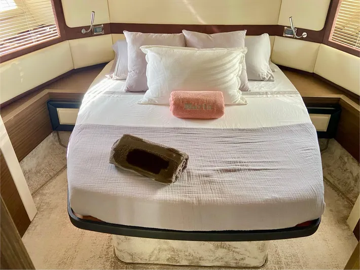  Yacht Photos Pics Luxurious bedroom interior of 2012 Azimut 55S yacht with plush bedding and elegant decor.