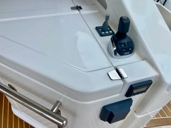  Yacht Photos Pics Control panel of a 2012 Azimut 55S yacht, featuring joystick and sleek design.