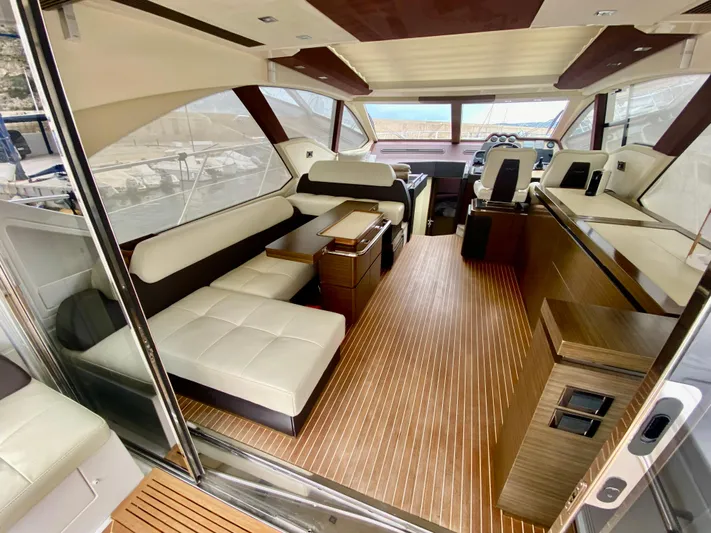  Yacht Photos Pics Luxurious interior of a 2012 Azimut 55S yacht with elegant seating and wood flooring.