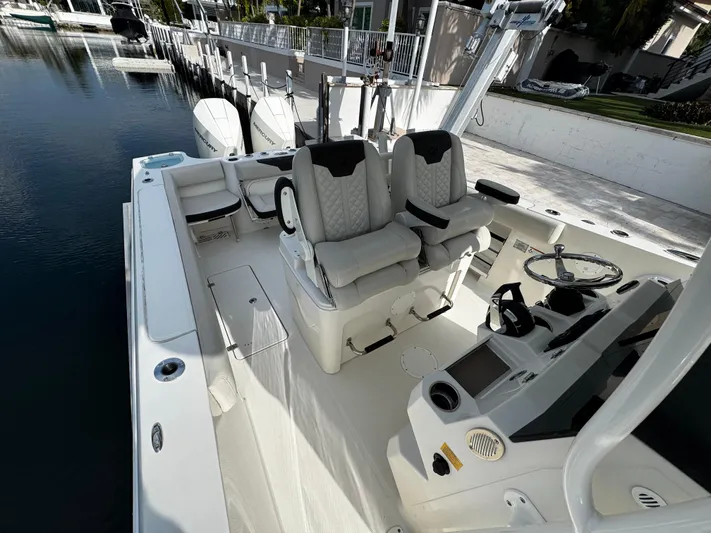  Yacht Photos Pics 2022 Sailfish 290 CC boat interior with dual seats and steering console.